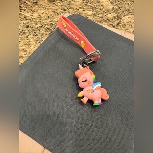 silicone unicorn keychain with a wristlet strap.